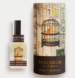 The perfume Song in D Minor no 13 is alongside a box with a birdcage with the saying Tokyomilk, Eau de parfum song in d minor printed on it