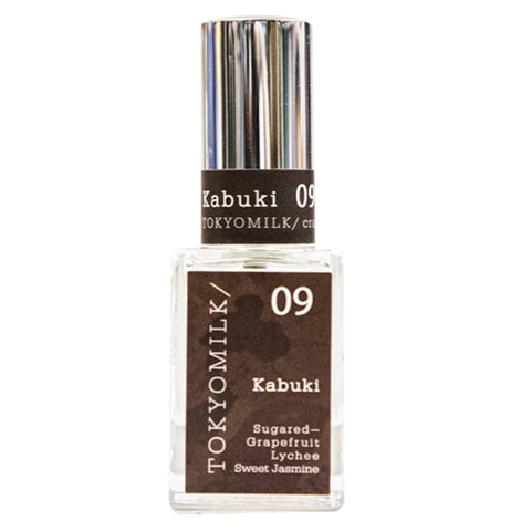 Kabuki perfume bottle with square base the contains the text that describes the scent of the perfume and chrome lid that contains the words "Kabuki" and Tokyo Milk