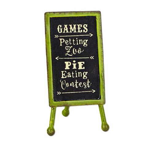 This sign has an eventuality that is green with a black chalkboard. The words, "Games, Petting Zoo, Pie Eating Contest" are all spelled out across the blackboard in white lettering.