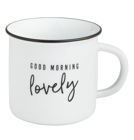 This white mug with a black ring around its brim has the words, "Good Morning Lovely" in black lettering.