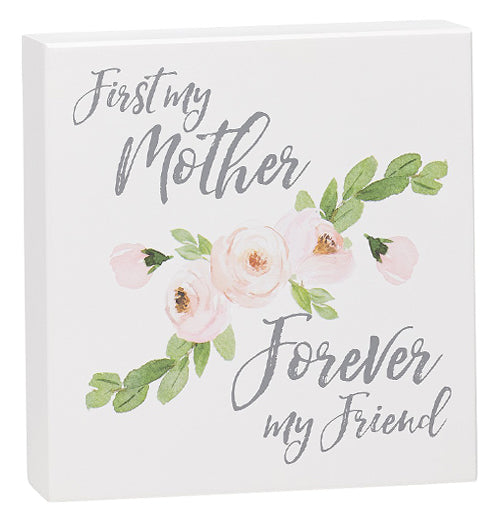 White box sign that says "First My Mother Forever My Friend."  It has pink roses in the middle of it.