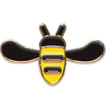 An enamel pin of a black and yellow honeybee.