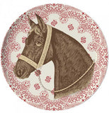 A pink coaster with a horse in the middle.
