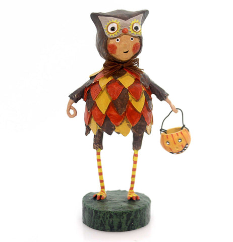 This figurine is of a boy dressed in an owl costume with brown, orange, and yellow while holding a trick or treat pumpkin bucket.