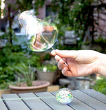 This is a pcture of a rainbow twirler that somebody is playing with. 