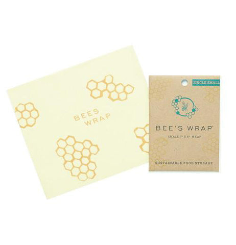 Reusable Wrap-Sandwich Bee's Wrap with its packaging beside it over a white background.