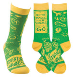 These yellow and green socks sport the words, "Oh the Places We Will Go, Adventure Awaits" in green over a yellow background.