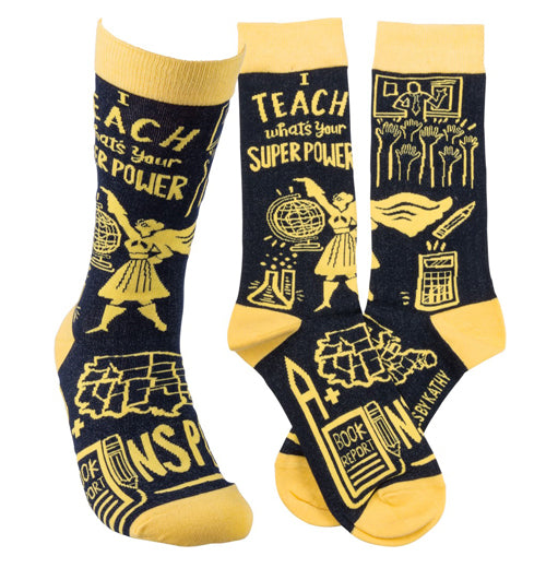 A pair of yellow and black socks and a single sock say, "I teach what&