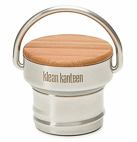This stainless steel lid with a steel handle has a top made of wood. The logo, "Klean Kanteen" is shown in brown lettering under the wooden top.
