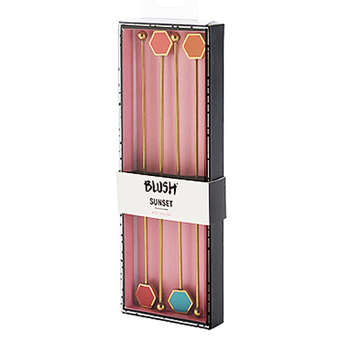 Different colored stirring sticks: coral, red, turquoise, and orange in package.