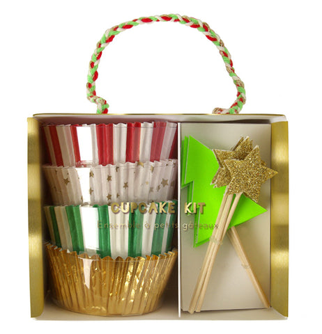This picture shows sets of cupcake bottoms in different Christmas Colors and patterns with toppers in the shape of stars and a christmas trees.