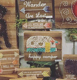The Happy Camper is a picture of a string art design made from metal and wood.