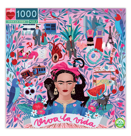 This pink box has an illustration of Frida Khalo with a black monkey on her shoulders. A series of colorful plant, building, and human designs surround the woman and monkey. At the bottom of the lid is a white banner with the words, "Viva La Vida" in magenta lettering.