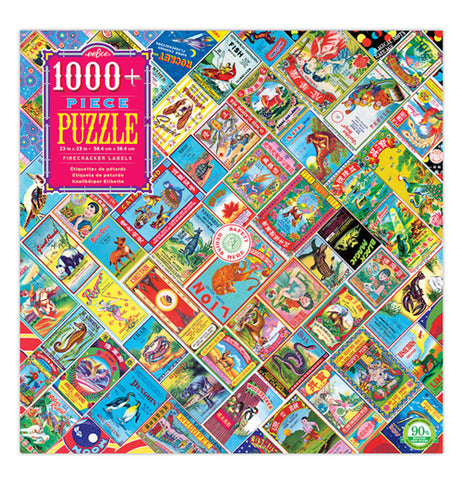 This puzzle box has a design of different Chinese firecracker labels that feature animals, people, and words written in Chinese. A hot pink square sits at the upper left hand corner with the words, "1000 Piece Puzzle" in white, blue, and yellow lettering.