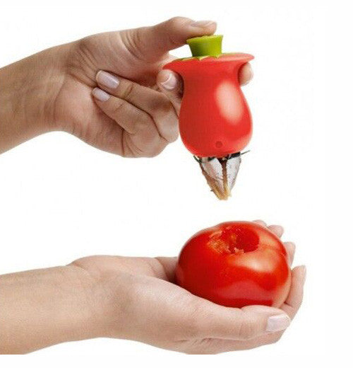 Push button to extend metal claws of red tomato corer. 