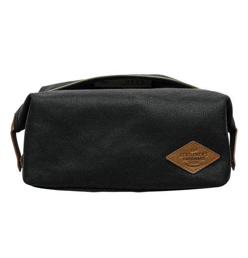 Black bag with brown leather tag that says "Gentleman&