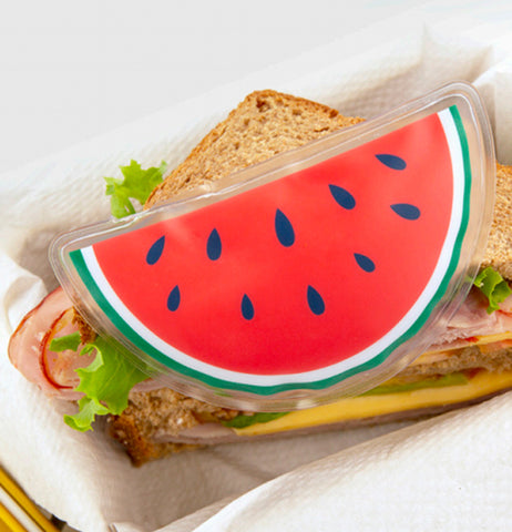The Watermelon cold pack sits on top of a sandwich. 
