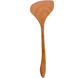 A brown, wooden, long handled spatula utensil stands straight up and down.